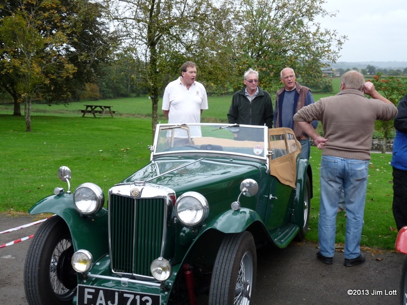 Andrew Owst, Steve Gardener, Edward Kirkland and Martin Lewis (with his back to the camera) discussing the finer points of Steve's MG TC
